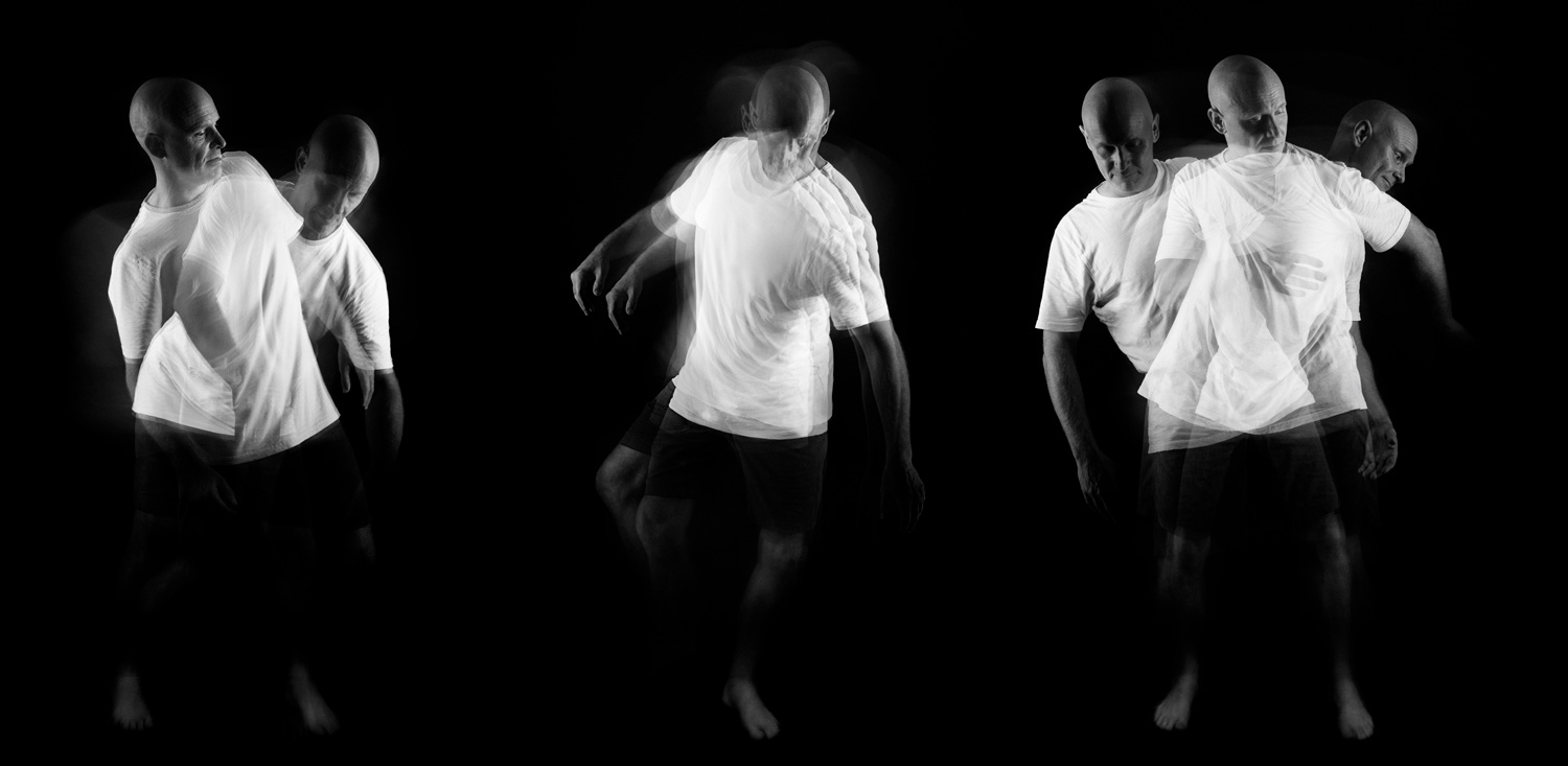 Triptych of a bald man in motion, captured with multiple exposures and a slow shutter speed against a black background